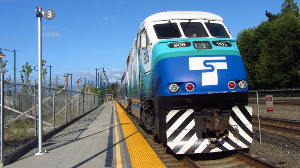 The front of a passenger train painted with the Sounder logo.