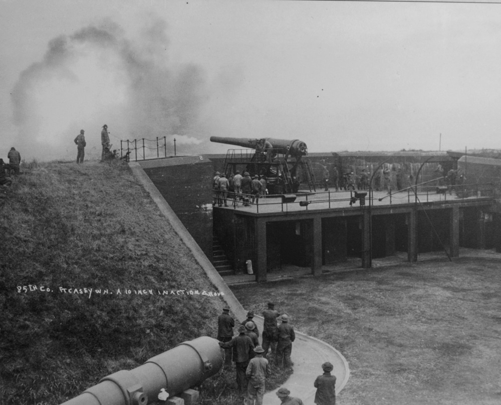 A large cannon fires over the wall at Ft. Casey.