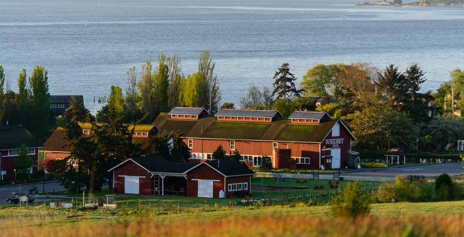 A large red barn with the words Whidbey and 1904 on it.