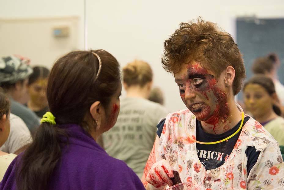 It takes just a little makeup to let your inner zombie come out. Here, one zombie is creating another in the Whidbey Playhouse makeup room.