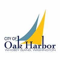 City of Oak Harbor logo with the words City of Oak Harbor Whidbey Island Washington and two stylized sail boat sails