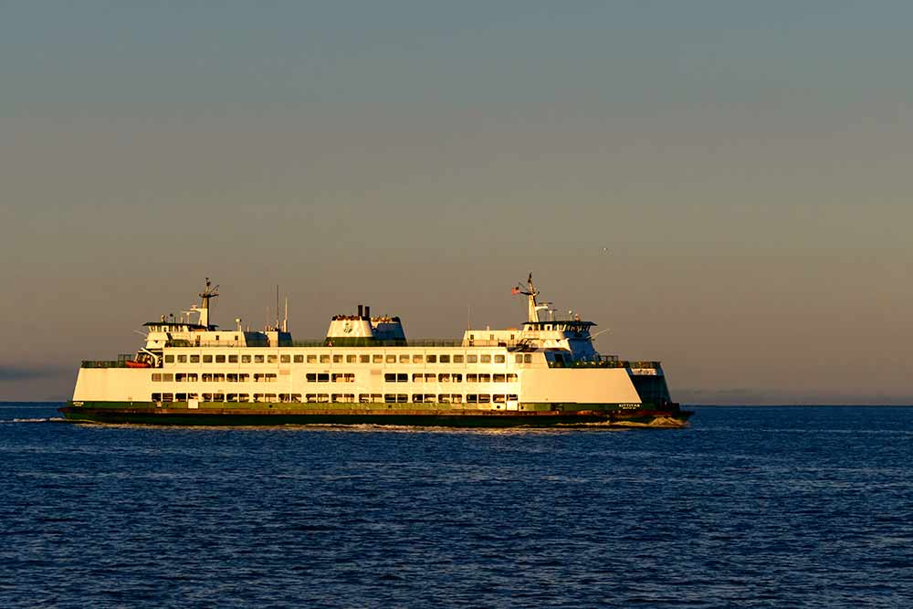 The sun glints off of a Washington state ferry boat.