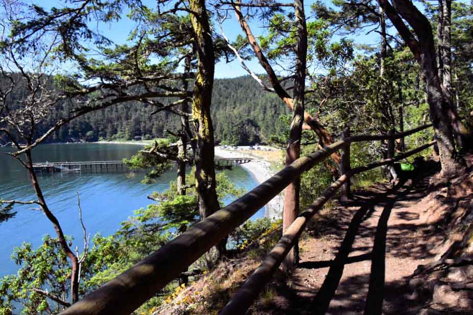 Dirt hiking trail with Bowman Bay in the background