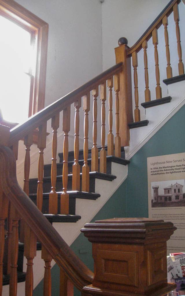 Interior stairway with wooden rail