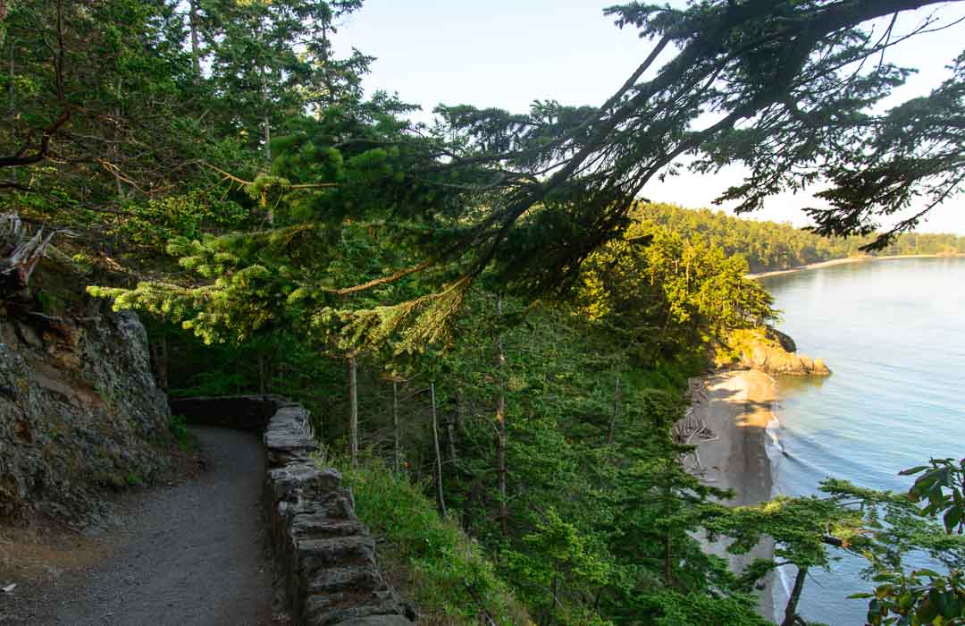 A cliffside trail overlooks the water of Deception Pass