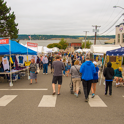 People in the street at an art festival.