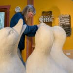 Sculptor Georgia Gerber works on giant clay ducks.
