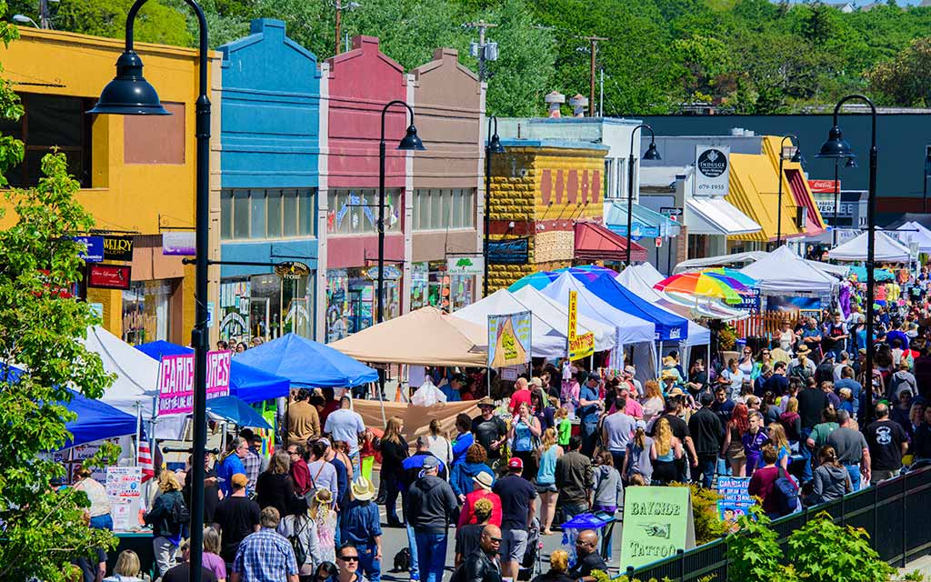 Merchant tents in the street on Pioneer Way during the festival, "Holland Happening."