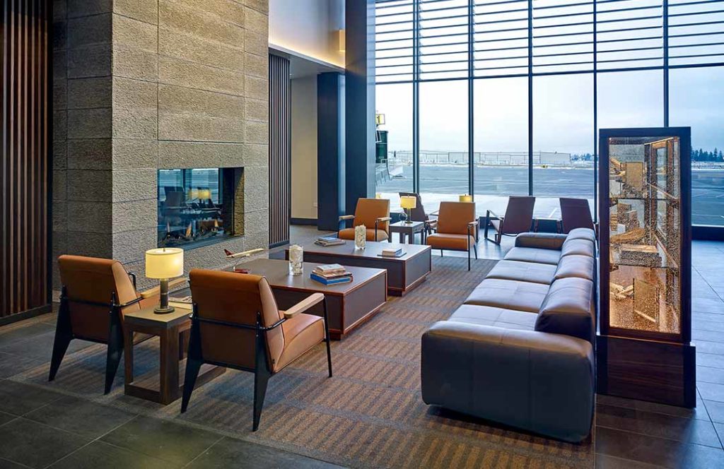 An airy lobby with a fireplace.