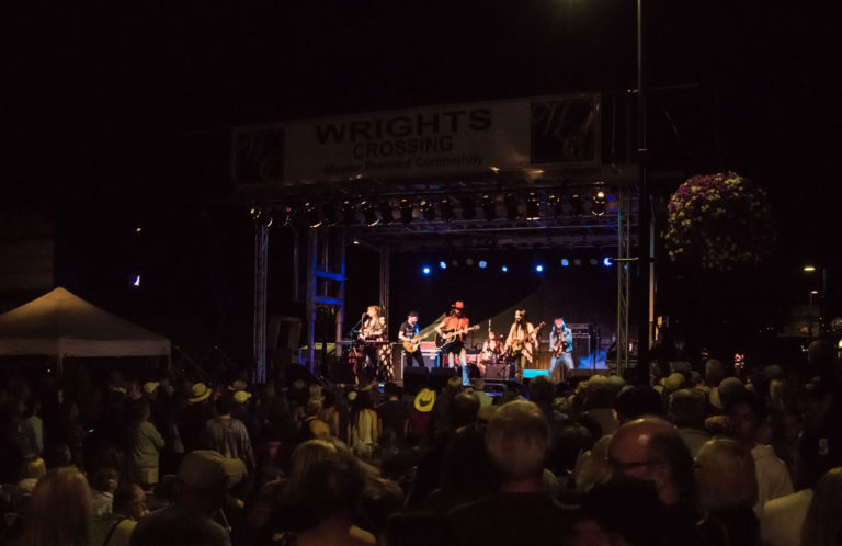 Performers on stage in front of an audience.