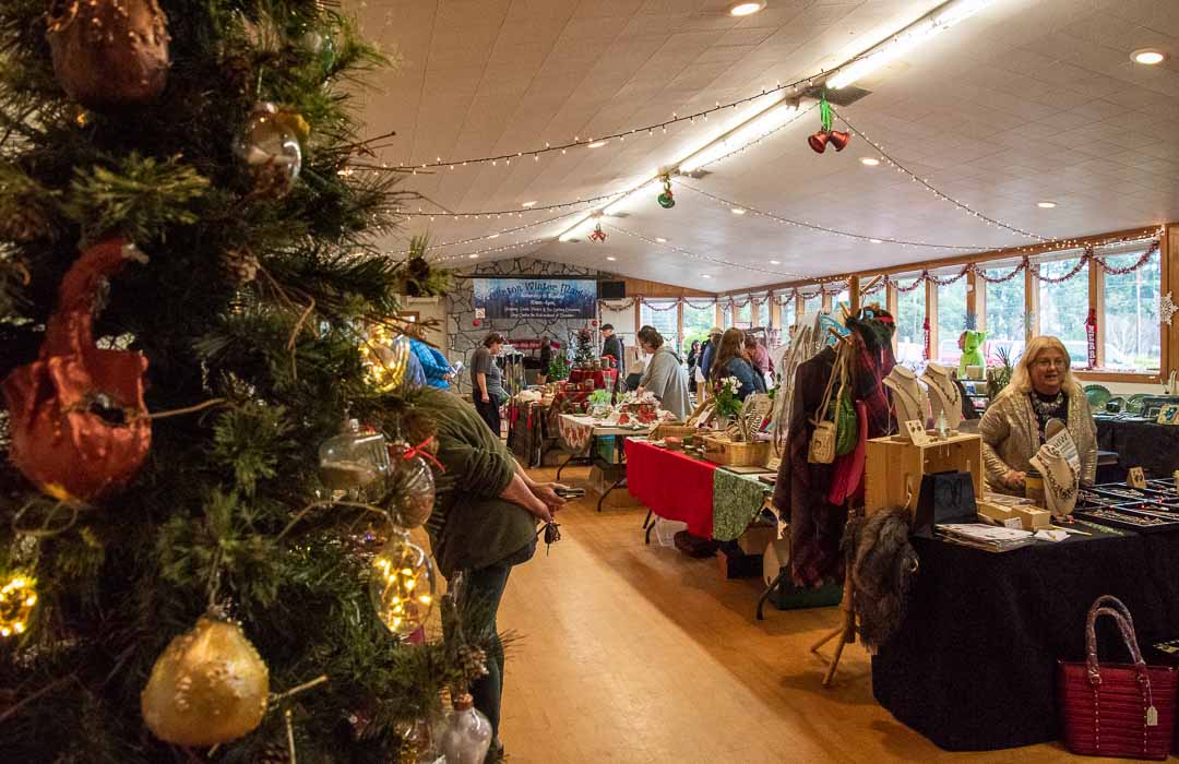 Shoppers look through hand-made crafts at Clinton's Winter Market