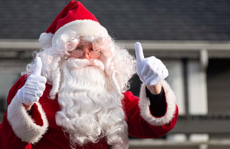 Santa gives the "two thumbs up" sign in the Langley Parade