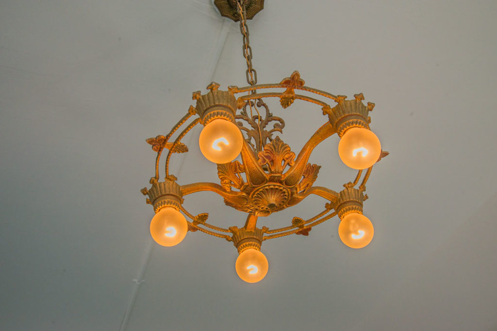 An old light fixture hangs from the ceiling.