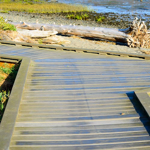 Wooden walkway on a beach.