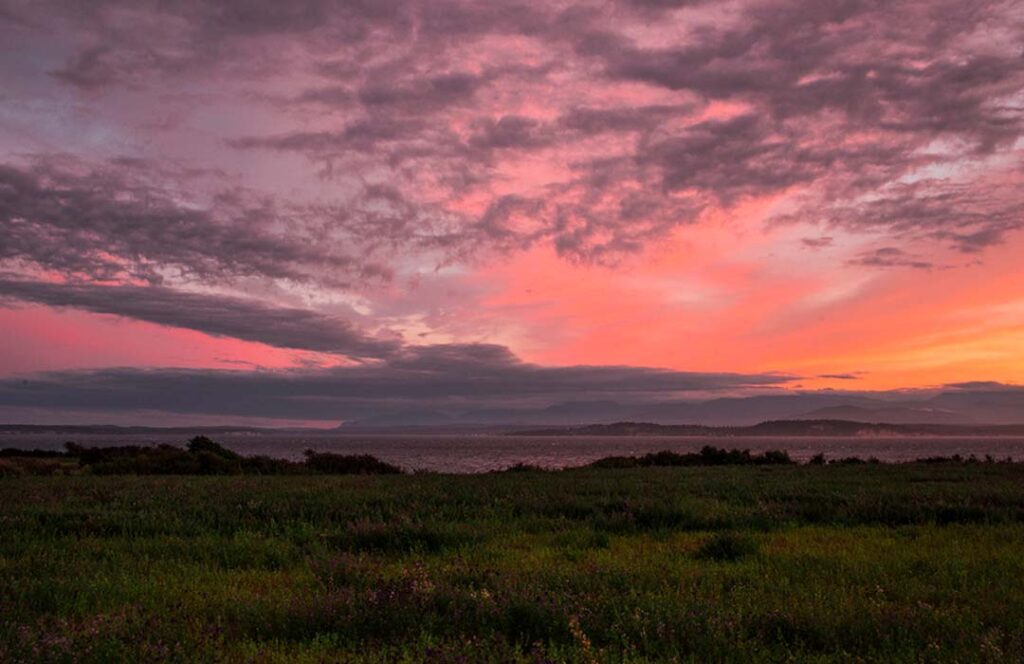 A colorful sunset over the water of Puget Sound.