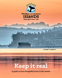 Cover of the Embrace Guide features a picture of the Coupeville Wharf in the mist and the words "Keep it real, a guide to more thoughtful travel on the islands."