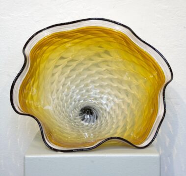 Irregularly shaped glass bowl.