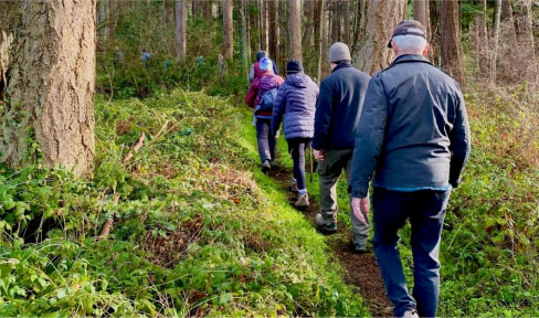 Image of people hiking on a trail during WCLT Walk and Talk Series