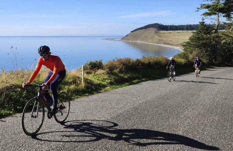 Bicyclers riding up Hill Road from Ebey's Landing beach