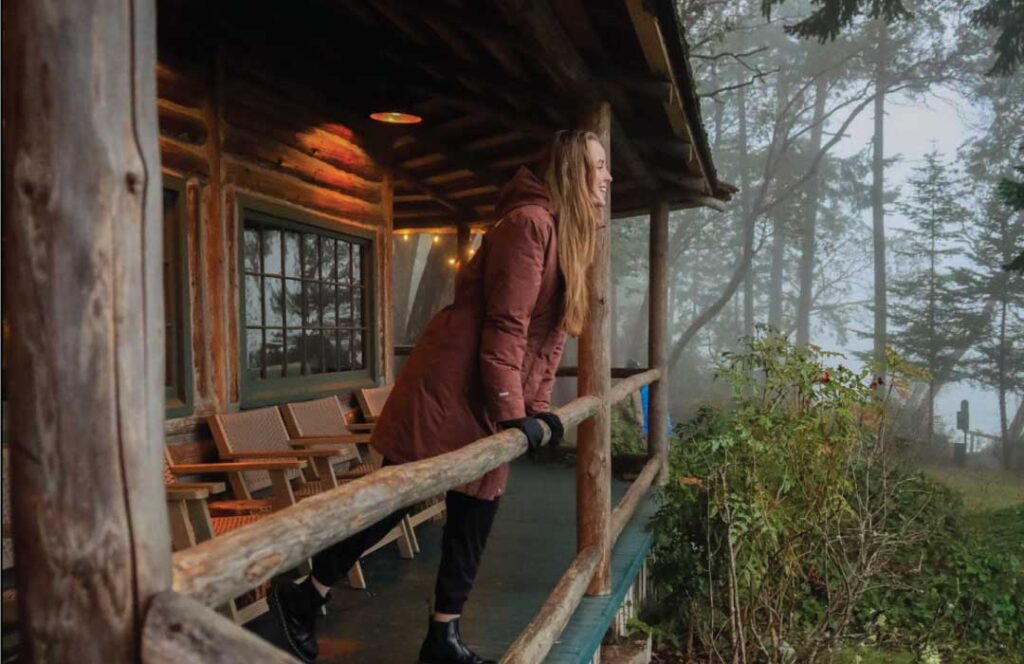 Person standing on Captain Whidbey Inns Porch