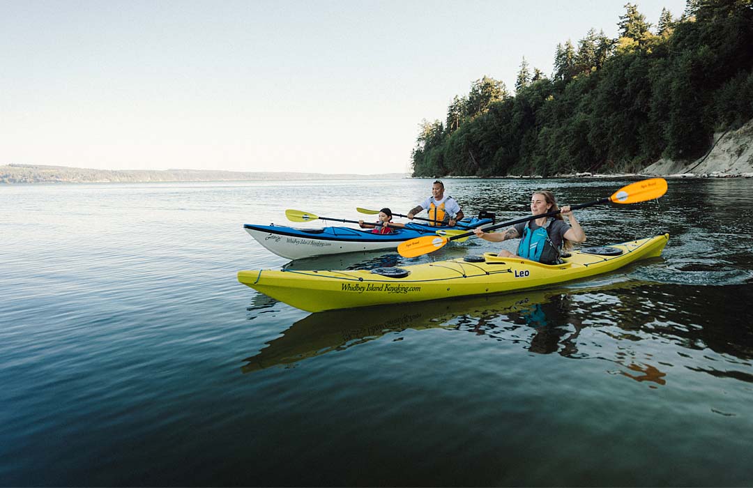 Family kayaking at Hidden Beach on Whidbey island